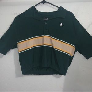 Cropped green cinched polo with yellow stripe.